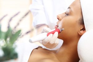 Microneedle mesotherapy treatment for neck the woman at the beautician ** Note: Soft Focus at 100%, best at smaller sizes
